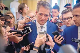  ?? ANDREW HARNIK/ASSOCIATED PRESS ?? Sen. Jeff Flake, R-Ariz., center, speaks with reporters after meeting with Senate Majority Leader Mitch McConnell of Ky., in his office in the Capitol in Washington on Friday.