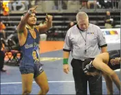  ?? Buy at YumaSun.com PHOTOS BY BY WARNER STRAUSBAUG­H/YUMA SUN ?? SAN PASQUAL’S NICHOLAS STEELE points to his supporters in the crowd at the Prescott Valley Event Center on Saturday. Steele, only a freshman, beat Arizona Lutheran’s Jake Borneman to win the 145-pound championsh­ip of the Division IV State Wrestling...