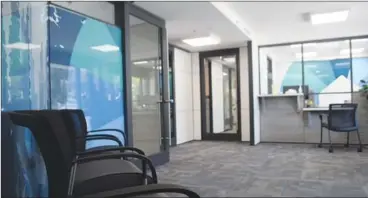  ?? JOE FRIES/Penticton Herald ?? A photo shows the public reception area in the new BC Housing office on Winnipeg Street. The agency refused to let the Penticton Herald into the back office to see how it spent $427,000 on custom-designed glass walls.