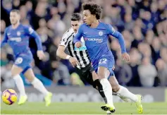  ??  ?? Chelsea’s Willian (right) vies with Perez during the English Premier League football match between Chelsea and Newcastle United at Stamford Bridge. — AFP photo