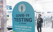  ?? BRIAN CASSELLA/CHICAGO TRIBUNE ?? A sign about COVID-19 testing Feb. 14 at O’Hare Internatio­nal Airport in Chicago.