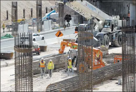  ??  ?? Constructi­on is underway on columns that will hold up the northbound and southbound lanes of Interstate 15 over Oakey Boulevard. Other big projects in Southern Nevada’s future include the new stadium for the NFL’s Raiders and the Interstate 11...