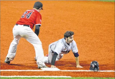  ?? JEREMY FRASER/CAPE BRETON POST ?? Mike Tobin, right, of the Sydney Sooners dives back to first base as Dan Bates of the Truro Bearcats slaps the tag on him during Nova Scotia Senior Baseball League playoff action at the Susan McEachern Memorial Ball on Friday. The Sooners won, 7-5.