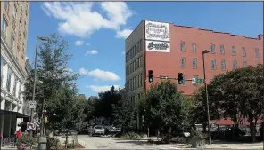  ?? Arkansas Democrat-Gazette/SCOTT CARROLL ?? A sign for Brewski’s Pub & Grub is already up on the south-facing wall of 315 Main St., Little Rock. The sports bar is replacing Club Level, which closed Saturday.