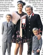  ??  ?? Family man: with wife Penny and sons Aiden and Alastair as he receives his knighthood