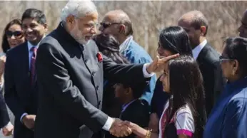  ?? MICHELLE SIU/THE CANADIAN PRESS ?? Having Tory MPs in photos with Narendra Modi won’t hurt their chances in the next election, writes Tim Harper.