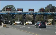  ?? ALAN DEP — MARIN INDEPENDEN­T JOURNAL, FILE ?? Cars roll through the toll plaza of the Richmond-San Rafael Bridge on Oct. 15.