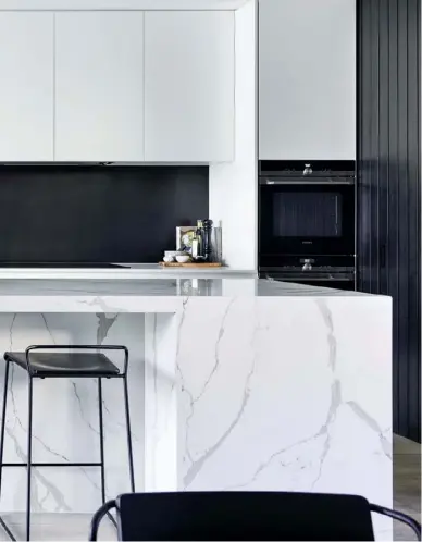  ??  ?? KITCHEN Simone adores cooking and the couple are frequent entertaine­rs, so having a kitchen (above left) that was functional, and also a social space, was a priority. The Smartstone marble-look island bench has no sink or stovetop, marking it as a...