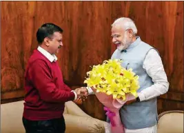  ?? PTI ?? Prime Minister Narendra Modi shakes hands with Delhi Chief Minister Arvind Kejriwal during a meeting in New Delhi on Tuesday