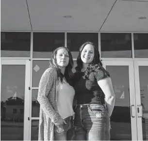  ?? JASON ELMQUIST/AP ?? Angela Morgan, left, pictured with her daughter, Sidney McLaughlin, was a plaintiff in a case involving a group of softball parents who filed a Title IX lawsuit against a school district in Stillwater, Oklahoma. The parties reached a settlement, but it took 10 months and came at a price.