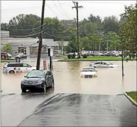  ?? SUBMITTED PHOTO ?? Cars sit in flood waters on Lancaster Avenue during Monday morning’s torrential downpours in Radnor.