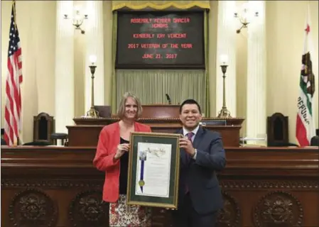  ?? COURTESY PHOTO ?? Kim Vincent receives the 56th Assembly District’s 2017 Veteran of the Year award by State Assemblyme­mber Eduardo Garcia on June 21 in Sacramento.