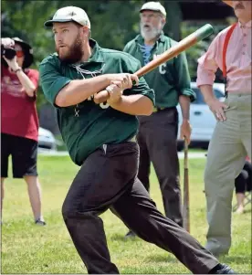  ??  ?? Mountain City Club team captain John “the Mayor” Hixson takes a swing.