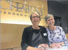  ??  ?? CHARM Diamond Centres employees Leah Dempsey and Charlene Davies agree the increase in foot traffic may not mean much for their store, but it could mean good things for the mall’s Christmas shopping season.