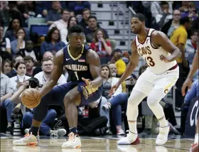  ?? RUSTY COSTANZA — THE ASSOCIATED PRESS ?? Pelicans forward Zion Williamson drives as Tristan Thompson defends during the first half Feb. 28 in New Orleans