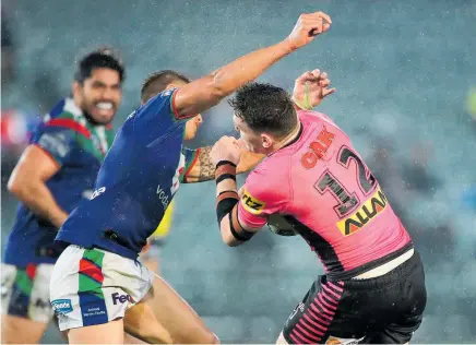  ?? Photo / Getty Images ?? Warriors halfback Chanel Harris-Tavita attempted a huge tackle on Liam Martin which was lucky to see neither player injured.