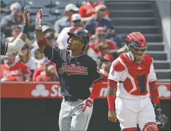  ?? [CHRIS CARLSON/THE ASSOCIATED PRESS] ?? Francisco Lindor celebrates after hitting a three-run homer in the fifth inning during the Indians’ fifth straight victory .