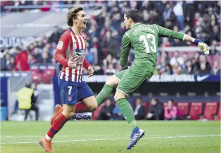  ?? (Photo: AFP) ?? Atletico Madrid’s French forward Antoine Griezmann (left) reacts after failing to score a goal against Getafe CF at the Wanda Metropolit­ano stadium in Madrid, Spain, yesterday.