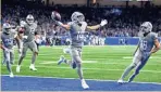  ?? GETTY IMAGES ?? Lions receiver Amon-Ra St. Brown celebrates after catching a touchdown to beat the Vikings, 29-27.