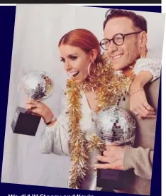  ??  ?? We did it! Stacey and Kevin clutch their Glitterbal­l trophies
