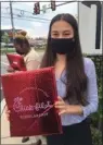  ?? PEG DEGRASSA - MEDIANEWS
GROUP ?? Linnea Si of Morton holds up the Scholarshi­p Package that she received from Chick-fil-A Thursday. Linnea has been working at the restaurant since 2017.