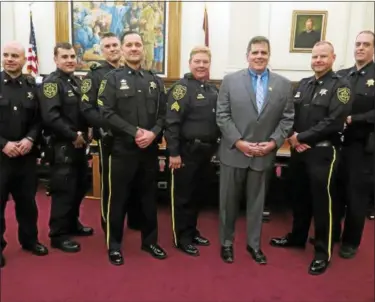  ?? SUBMITTED PHOTO ?? Pictured during the promotion ceremony are, from left; Cpl. James Bryan Subbio, Cpl. Trevor Keller, Sgt. Ronald Cole, Sgt. Mark Huzzard, Lt. Joann Lawlor, Sheriff Sean P. Kilkenny, Chief Deputy Adam T. Berry, Cpl. Matthew Pokorny.