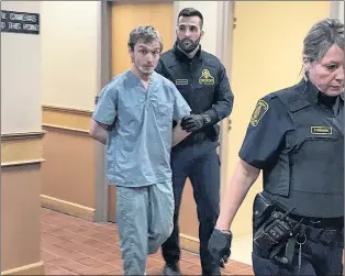  ?? TARA BRADBURY/THE TELEGRAM ?? Jake Dalton, 23, is escorted out of a provincial courtroom in St. John’s Monday afternoon, after making his first appearance before a judge in connection with a crash in Portugal Cove-st. Philip’s Sunday night.