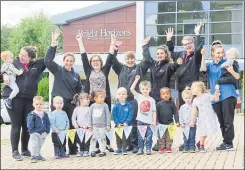  ??  ?? Staff and children celebrate their “outstandin­g” rating