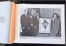  ??  ?? A photograph in one of Bert Seabourn’s books depicts the artist and wife Bonnie with President Gerald Ford and first lady Betty Ford along with with one of Seabourn’s paintings and a thank-you letter from President Ford.