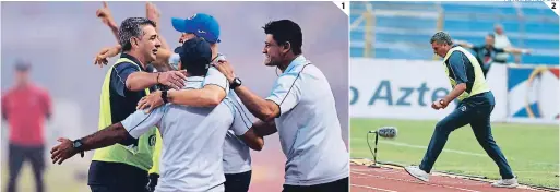  ?? FOTOS: EL HERALDO ?? (1) El tradiciona­l festejo del Cuerpo Técnico de Motagua. (2) Diego Vazquez celebró así el primer gol. El argentino se puso eufórico cuando Moreira anotó el 1-0 en el Olímpico.