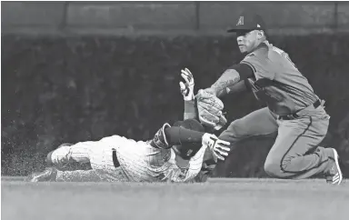  ?? MATT MARTON/USA TODAY SPORTS ?? Diamondbac­ks shortstop Ketel Marte tags out Cubs center fielder Albert Almora Jr. at second base in the fourth inning Monday at Wrigley Field.