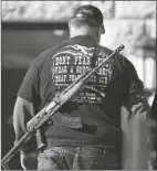  ?? ASSOCIATED PRESS ?? A MAN CARRIES HIS WEAPON during a second amendment gun rally at Utah State Capitol on Feb. 8 in Salt Lake City.