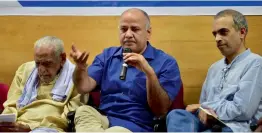  ?? — PTI ?? Delhi deputy CM Manish Sisodia speaks as freedom fighter H.S. Doreswamy (left) and AAP leader Ashwin Mahesh look on during the launch of the AAP Citizen Empowermen­t programme in in Bengaluru on Saturday.