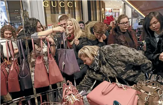 ?? PHOTO: REUTERS ?? Black Friday handbag deals bring out the bargain hunters to Macy’s in Manhattan.
