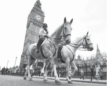  ??  ?? Police on horseback patrol near Westminste­r Bridge in London, Britain. —Reuters photo