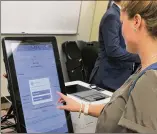  ?? GEORGIA SECRETARY OF STATE ?? Voters will make their choices on touchscree­ns, which are connected to computers that will print out paper ballots for tabulation.