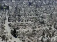  ?? MARCIO JOSE SANCHEZ—THE ASSOCIATED PRESS ?? In this Oct. 14, 2017, file photo, an aerial view shows the devastatio­n of the Coffey Park neighborho­od after a wildfire swept through in Santa Rosa, Calif. President Donald Trump’s tariffs on imported constructi­on materials are making it more expensive to rebuild homes lost to wildfires and other natural disasters. The taxes come at a time when several other factors are also driving up building costs.