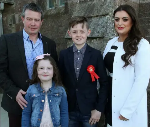  ??  ?? Dylan Moran who made his confirmati­on in Rathangan on Saturday morning, with Damien, Isabella and Edwina Moran.