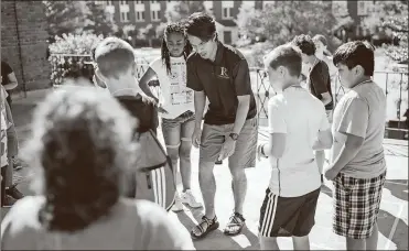  ?? / Rome City Schools ?? Rome City Schools instructor Luis Goya teaches civil engineerin­g by having students walk the city streets drawn on the sidewalk. The students represente­d the traffic on the streets.