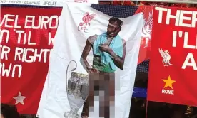  ??  ?? The contorvers­ial banner of Divock Origi on display in the Liverpool section during June’s Champions League Final at the Estadio Metropolit­ano. Photograph: No Credit