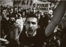  ?? Amir Levy / Getty Images ?? Protesters demanded that Netanyahu resign for how his government lost its grip on Israel’s coronaviru­s crisis.