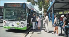  ?? XABISO MKHABELA / XINHUA ?? People wait to board a BYD electric bus in Cape Town, South Africa, on Feb 28. The China-made buses have been incorporat­ed into the day-to-day operations of Golden Arrow Bus Services.