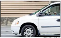  ?? AP/BRINLEY HINEMAN ?? A man checks his phone while driving down Interstate 70 in Atlanta earlier this month.