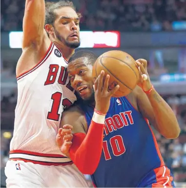  ?? | NAM Y. HUH/AP ?? Bulls center Joakim Noah, who had six points, 12 rebounds and 10 assists, tries to stop Greg Monroe of the Pistons.
