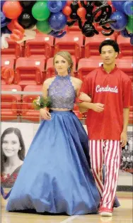  ??  ?? Sophomore maid Sagely Houghland, daughter of Chuck and Lexy Houghland, escorted by Decory Thomas, son of Leon and Falon Thomas.