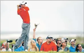  ?? — Photo by The Associated Press ?? Rory McIlroy watches his drive from the eighth tee during the final round of the PGA Championsh­ip at the Kiawah Island Golf Resort in Kiawah Island, S.C., Sunday. McIlroy won the event, becoming the sixth youngest golfer to capture to major titles.