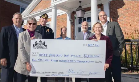  ?? SUBMITTED PHOTO ?? State Sen. Maria Collett, right, and state Rep. Nancy Guenst, left, present a check for a new police station in Upper Moreland.