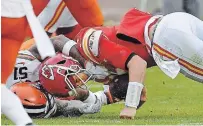  ?? RICH SUGG KANSAS CITY STAR ?? Chiefs quarterbac­k Patrick Mahomes, right, is hit hard by Cleveland Browns outside linebacker Mack Wilson in the third quarter Sunday at Arrowhead Stadium in Kansas City. Mahomes was hurt on the play and did not return to the game.