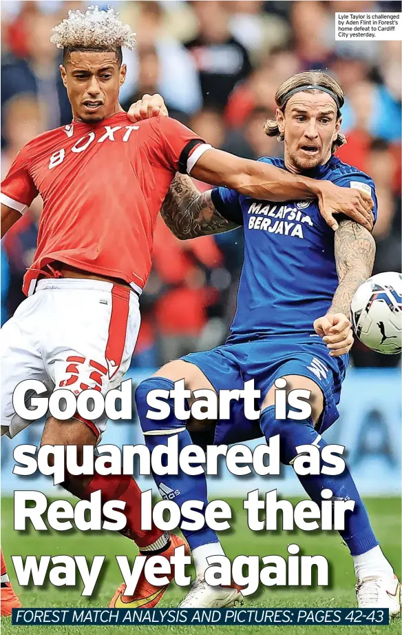  ??  ?? Lyle Taylor is challenged by Aden Flint in Forest’s home defeat to Cardiff City yesterday.