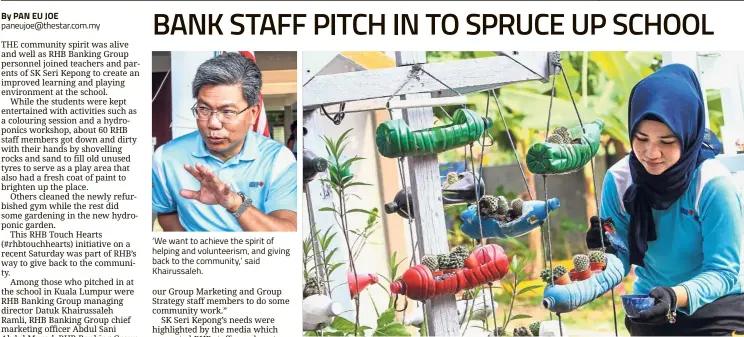  ??  ?? ‘ We want to achieve the spirit of helping and volunteeri­sm, and giving back to the community,’ said Khairussal­eh. RHB personnel Aziana Ariffin tending to the hydroponic­s garden at SK Seri Kepong, newly set up under the bank’s # rhbtouchhe­arts initiative.